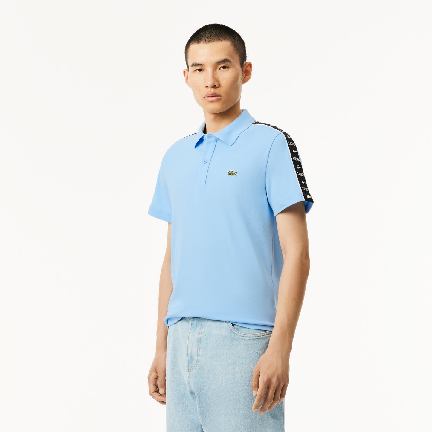 Camiseta tipo polo Lacoste de piqué elástico con raya y logo
