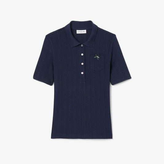 Suéter tipo polo Lacoste con bolsillo y manga corta para dama